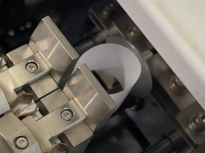 Compression resistance of looped specimen is measured by load cell